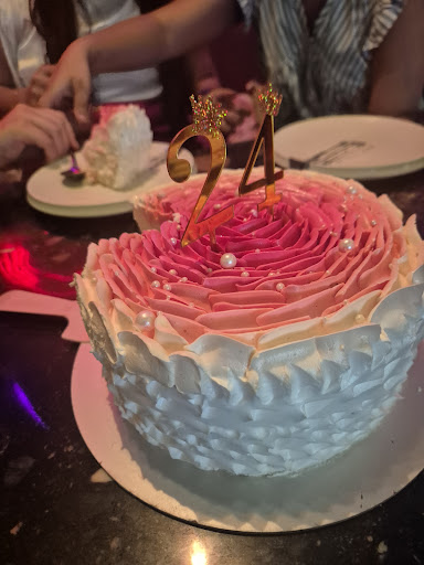 Pink rosette cream cake