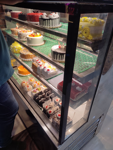 Fresh cakes and pastries on display at Mr. Jain Bakery